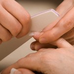 bigstock-Manicurist-filing-down-the-acr-17822621