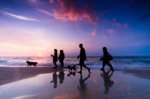bigstock-Family-walk-on-the-beach-at-su-18950786