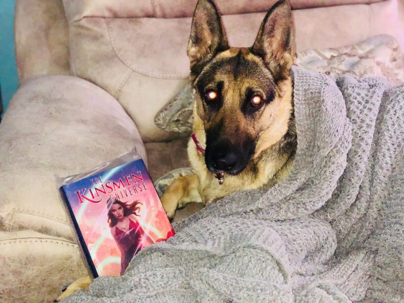 Artha snuggling with her copy
